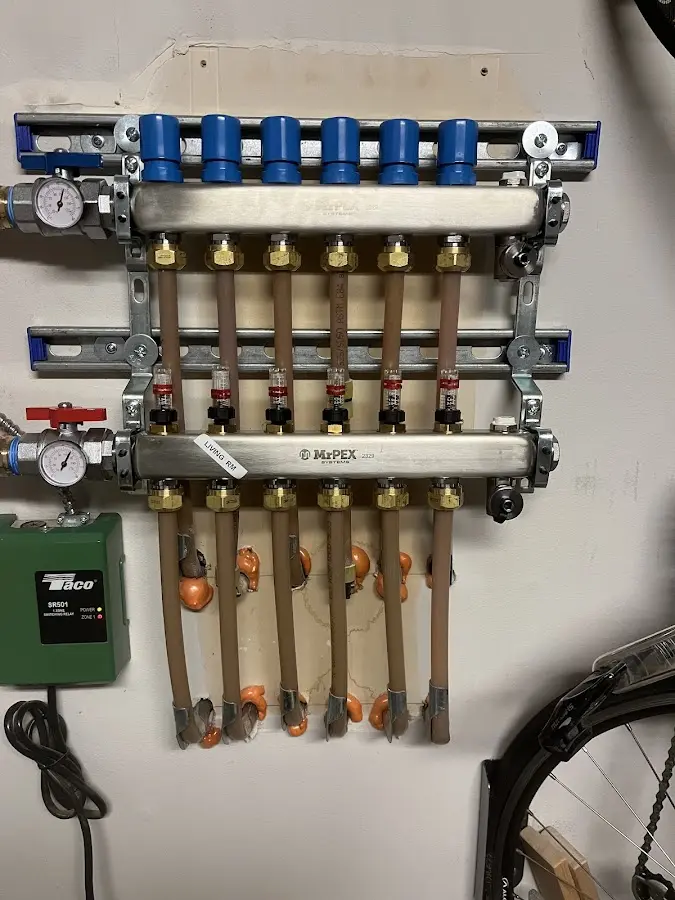 Plumber performing Water Heater Repair at a residential property in Candia